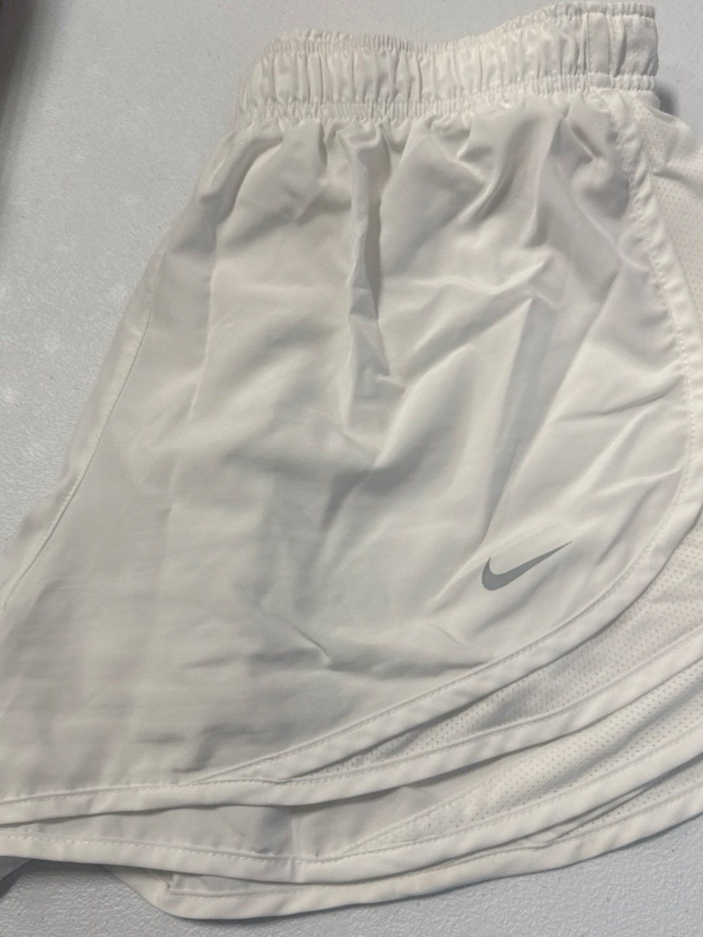 Nike White women’s Athletic Shorts with Gray Swoosh